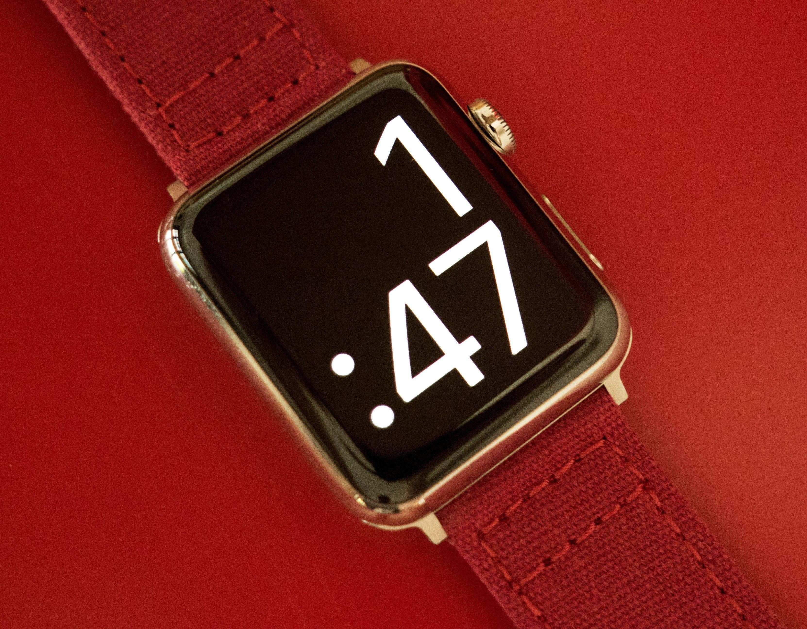 Rose gold apple hotsell watch with red band